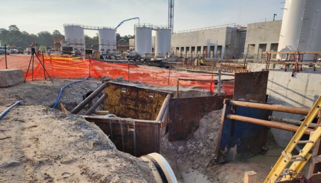 Technician using a Leica RTC360 LiDAR scanner to capture a construction site for as-built documentation.