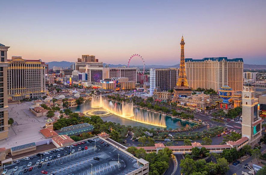Picture of the Las Vegas Strip showcasing hotels, casinos, and city skyline at night.