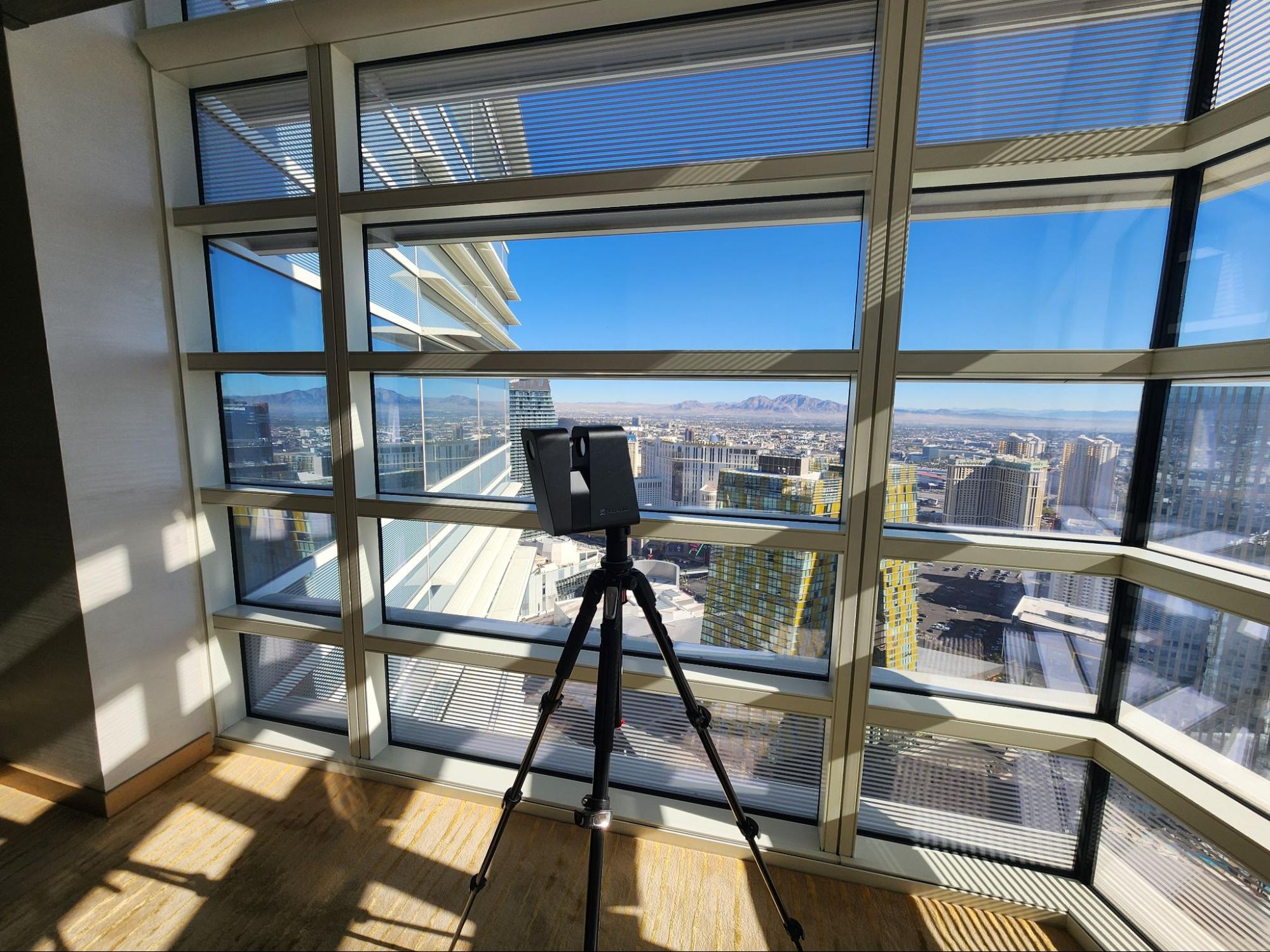 Matterport 3D laser scanner positioned in hotel guest corridor capturing as-built conditions
